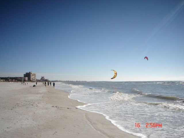 Men flying kites to surf the waters on St. Pete Beach near Dolphin Beach Resort/ mid January 2005 Gulf of Mexico.